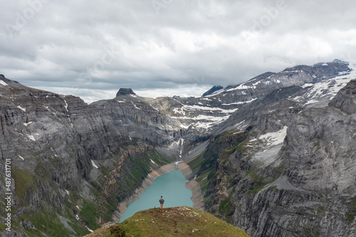 Amazing shot of a beautiful landscape in the alps of Switzerland. Wonderful flight with a drone over an amazing landscape in the canton of Glarus. Epic view over a lake called Limmerensee.