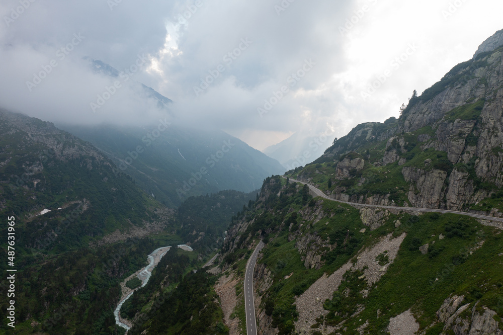 Fototapeta premium Amazing shot of a beautiful landscape in the alps of Switzerland. Wonderful flight with a drone over an amazing landscape in the canton of Bern. Epic view over a river.