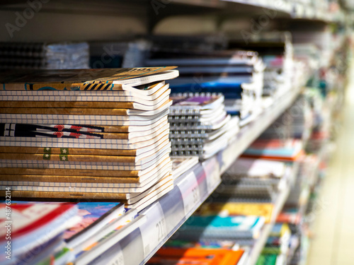 Stacks of notebooks on the shelf in the store.