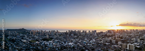 Aerial panorama of Honolulu at sunset, including Diamond Head and Waikiki in the distance