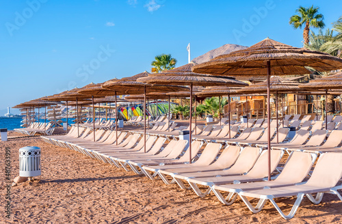 Morning at central public beach of the Red Sea in Eilat - famous tourist resort and recreational city in Israel