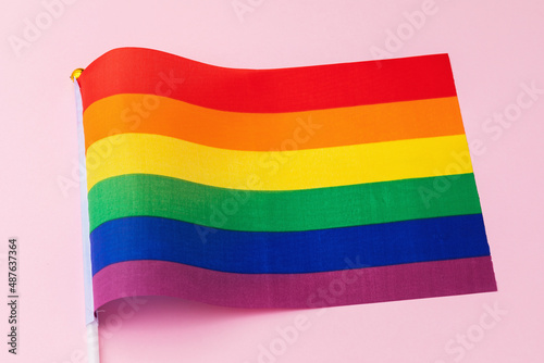 LGBT flag on a pink background  close-up