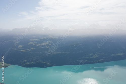 Amazing shot of a beautiful landscape in the alps of Switzerland. Wonderful flight with a drone over an amazing landscape in the canton of Bern. Epic view over a lake called Brienzersee.