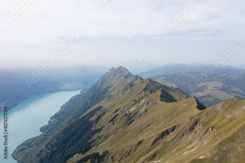 Amazing shot of a beautiful landscape in the alps of Switzerland. Wonderful flight with a drone over an amazing landscape in the canton of Bern. Epic view over a lake called Brienzersee.