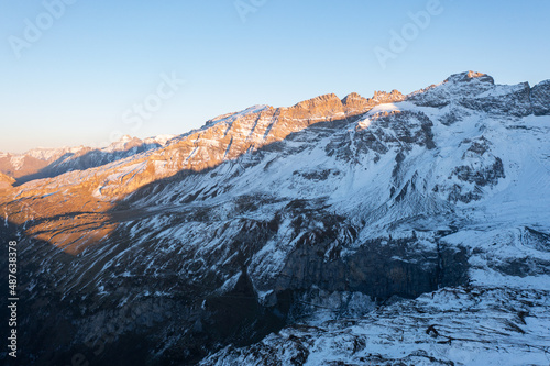 Amazing sunset in the alps of Switzerland. Wonderful flight with a drone over an amazing landscape in the canton of Uri and Glarus. Epic view over a street called Klausenpass.