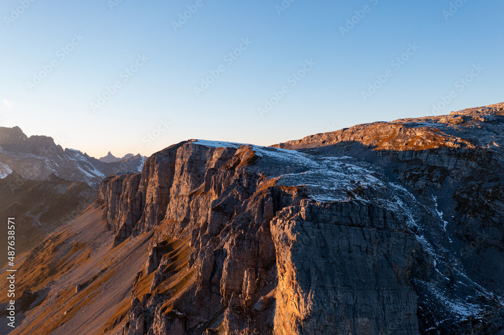 Amazing sunset in the alps of Switzerland. Wonderful flight with a drone over an amazing landscape in the canton of Uri and Glarus. Epic view over a street called Klausenpass.