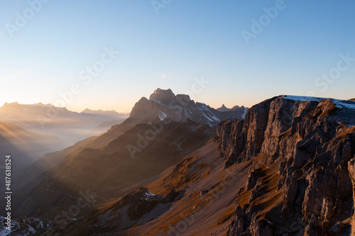 Amazing sunset in the alps of Switzerland. Wonderful flight with a drone over an amazing landscape in the canton of Uri and Glarus. Epic view over a street called Klausenpass. © Philip
