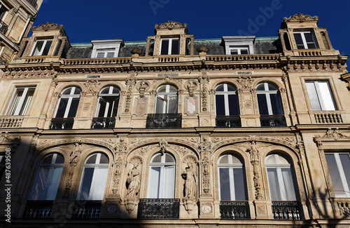 The facade of traditional French house with typical balconies and windows. Paris. © kovalenkovpetr
