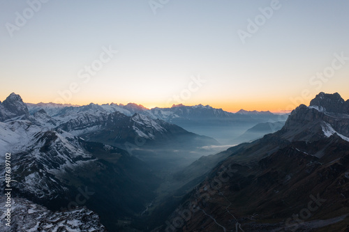 Amazing shot of a beautiful landscape in the alps of Switzerland. Wonderful flight with a drone over an amazing landscape in the canton of Glarus. Epic view at sunset.