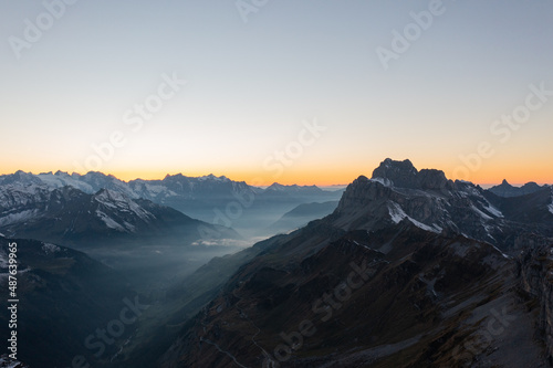 Amazing shot of a beautiful landscape in the alps of Switzerland. Wonderful flight with a drone over an amazing landscape in the canton of Glarus. Epic view at sunset.