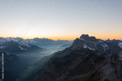 Amazing shot of a beautiful landscape in the alps of Switzerland. Wonderful flight with a drone over an amazing landscape in the canton of Glarus. Epic view at sunset.