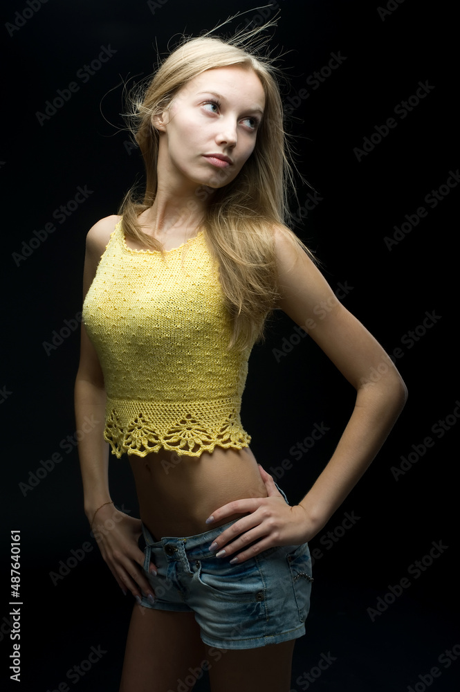 Young pretty woman with flower over black Young pretty woman with flower over black