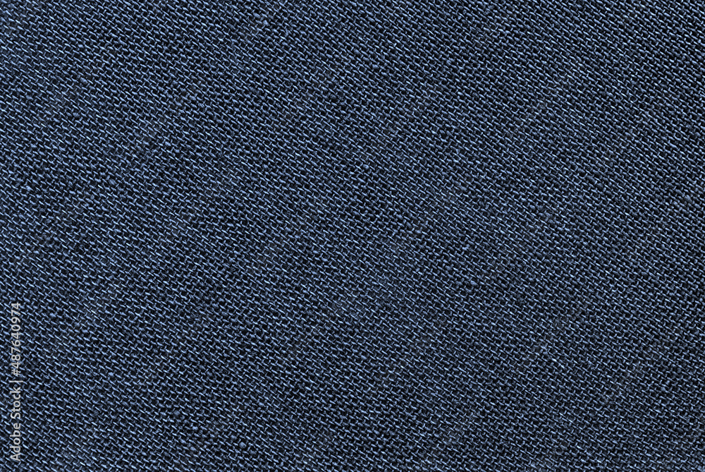 Navy blue canvas or linen fabric texture as background Navy blue canvas or linen fabric texture as background