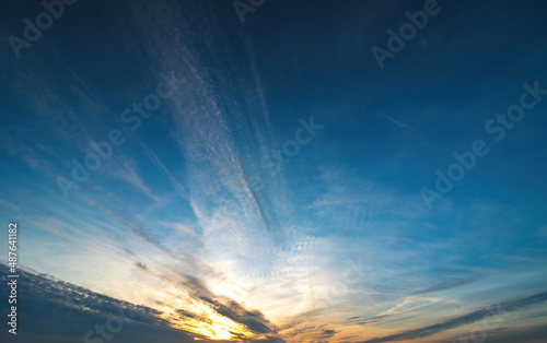 blue sky with spindrift clouds at sunset