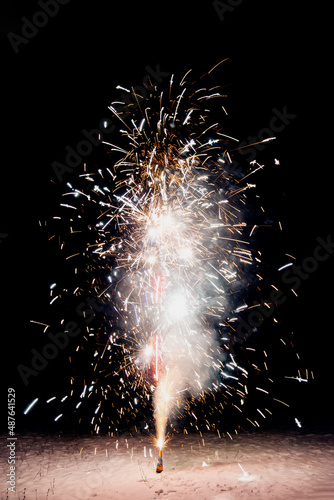 Fireworks in the backyard. Bright festive fireworks and sparkler on a black background . Isolated.