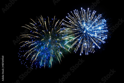 blue fireworks on a black background. Festive Christmas lighting element for decoration. Sparks. Fireworks Are A Class Of Explosive Pyrotechnic Devices Used For Aesthetic Purposes. Isolated 