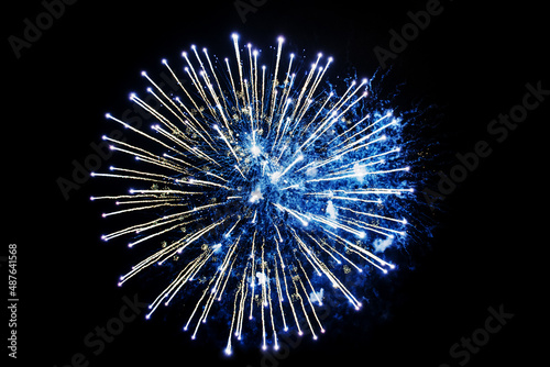 blue fireworks on a black background. Festive Christmas lighting element for decoration. Sparks. Fireworks Are A Class Of Explosive Pyrotechnic Devices Used For Aesthetic Purposes. Isolated 