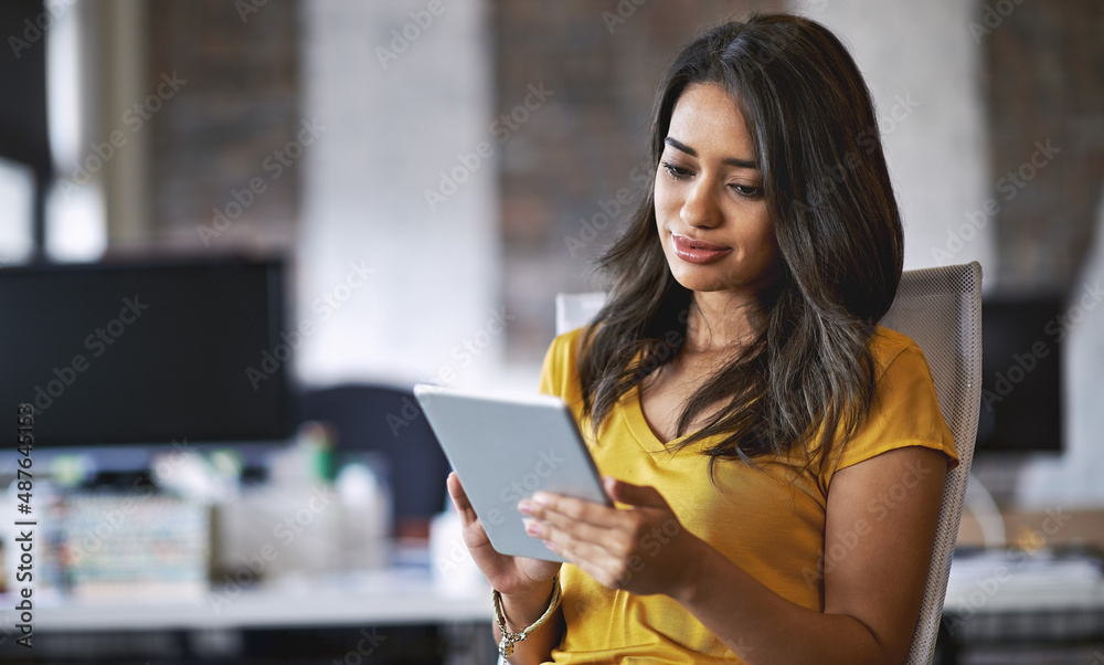 Now I can get feedback more quickly and conveniently. Shot of a young designer working on a digital tablet in an office. Now I can get feedback more quickly and conveniently. Shot of a young designer working on a digital tablet in an office.