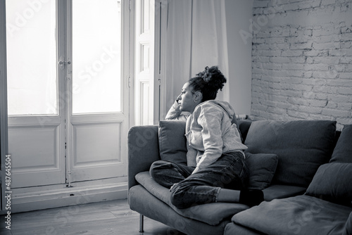 Distressed sad young woman at home feeling lonely and exhausted suffering from depression