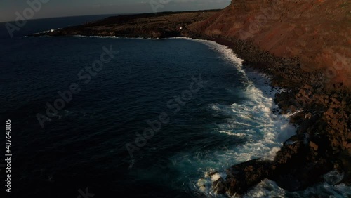 Aerial dolly over naturist beach Verodal in the rays of setting sun photo