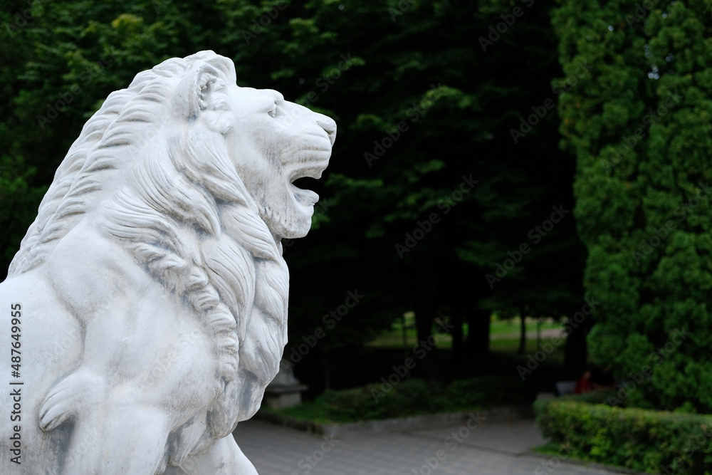 white lion statue in the park