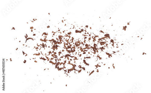 Pile chopped, milled, powder dark chocolate isolated on white, top view