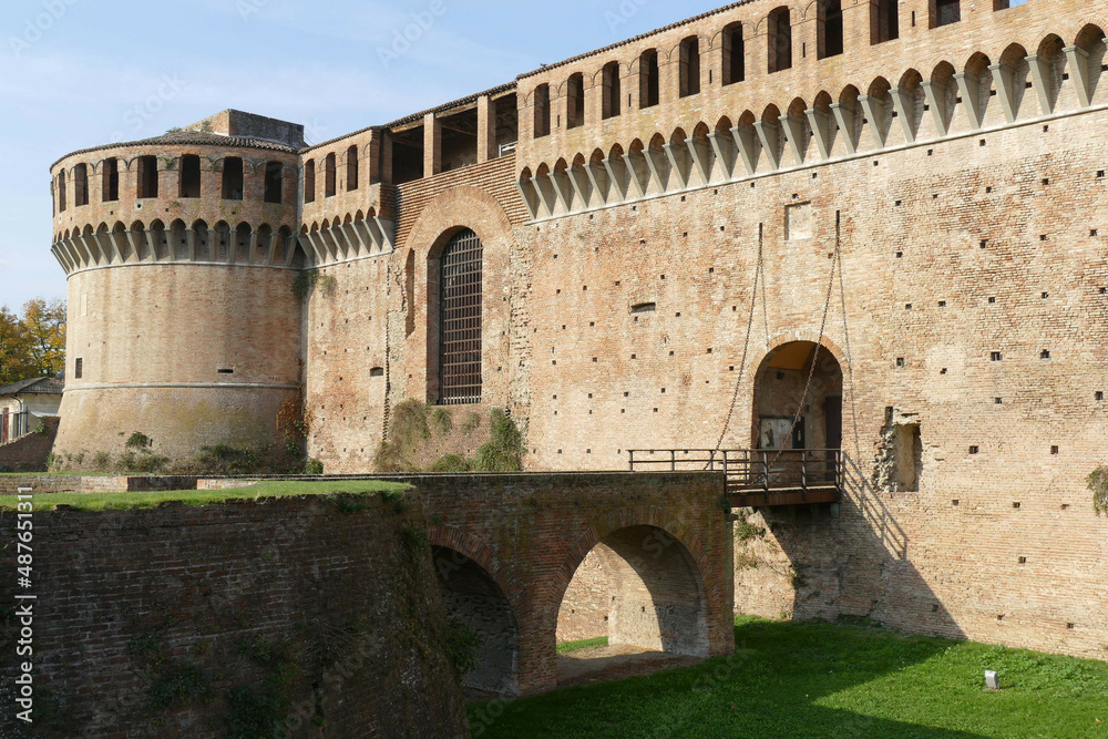 Sforza Castle in Imola, the wooden drawbridge with chains over the moat in front of the main entrance door