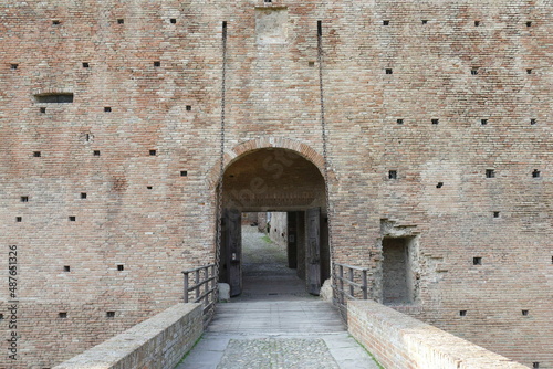 Sforza Castle in Imola, the wooden drawbridge with chains over the moat in front of the main entrance door photo