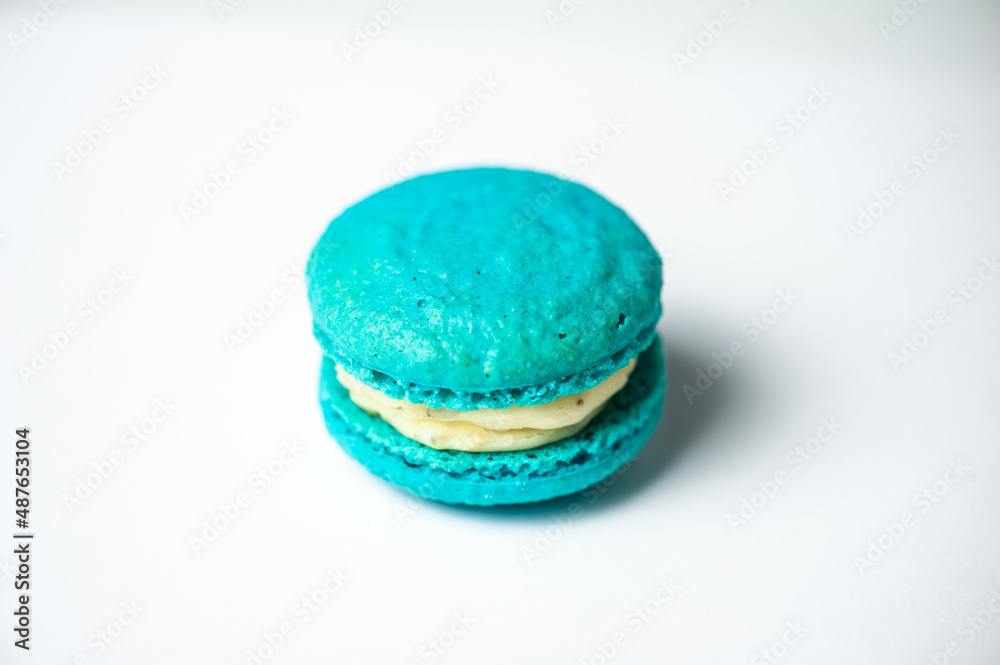 Colorful macarons cake, top view flat lay, fly falling sweet macaroon on color white isolated background. Minimal concepts falling macaroons pattern above, food natural background Colorful macarons cake, top view flat lay, fly falling sweet macaroon on color white isolated background. Minimal concepts falling macaroons pattern above, food natural background