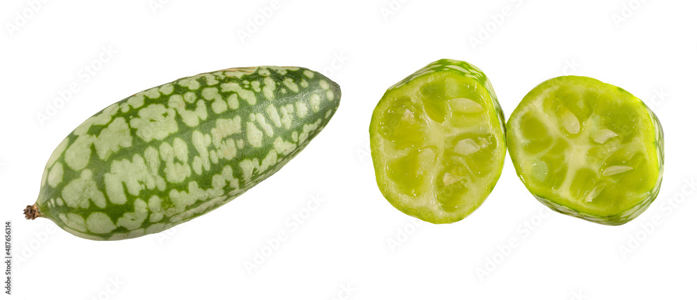 one whole and two pieces of melothria scabra , Mexican sour mini cucumber gherkin cut off and isolated on white background. one whole and two pieces of melothria scabra , Mexican sour mini cucumber gherkin cut off and isolated on white background.