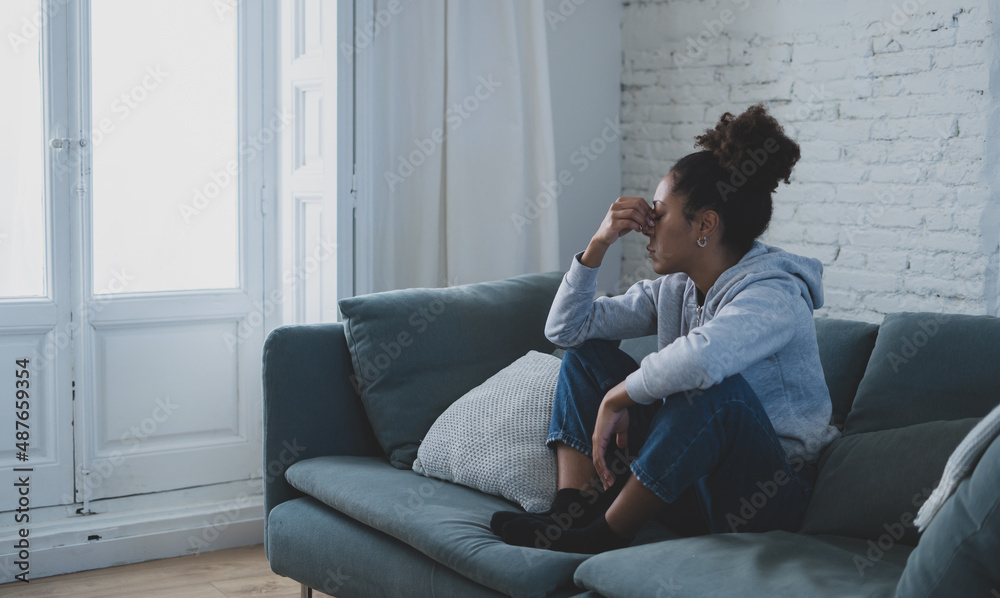 Depressed and distressed african american woman feeling lonely, sad and exhausted Depressed and distressed african american woman feeling lonely, sad and exhausted