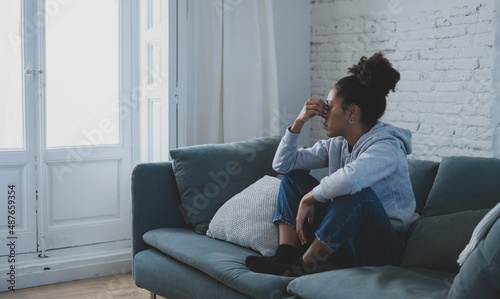 Depressed and distressed african american woman feeling lonely, sad and exhausted