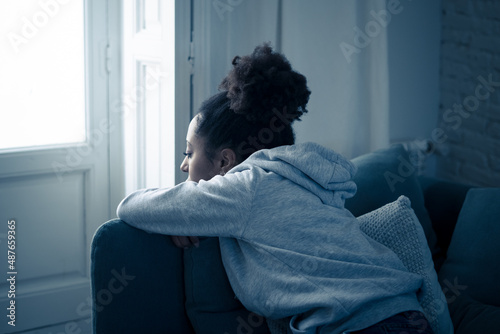 Young african american woman suffering from depression, anxiety and mental health illness