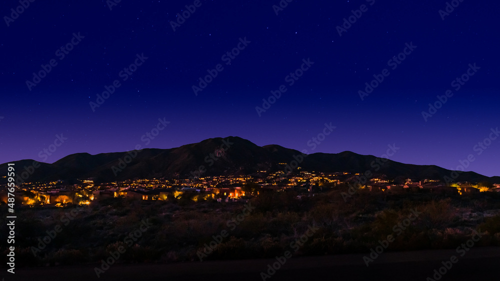Night view of lit houses at the Tonto Hills Subdivision in Cave Creek, Arizona