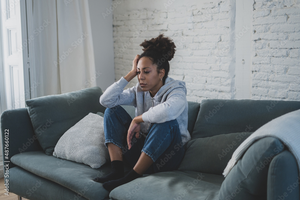 Lonely african american young woman suffering from depression, stress and mental health disorders Lonely african american young woman suffering from depression, stress and mental health disorders