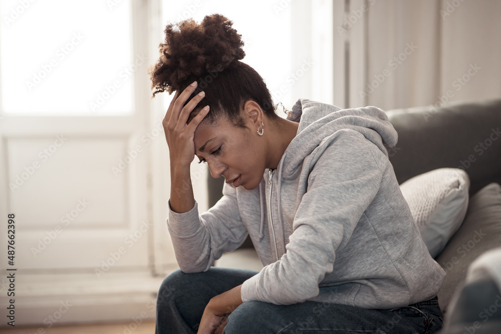 Young african american woman suffering from depression, anxiety and mental health illness Young african american woman suffering from depression, anxiety and mental health illness