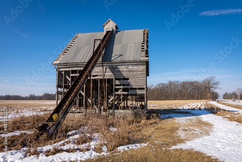 Old abandoned barn and conveyor. photo