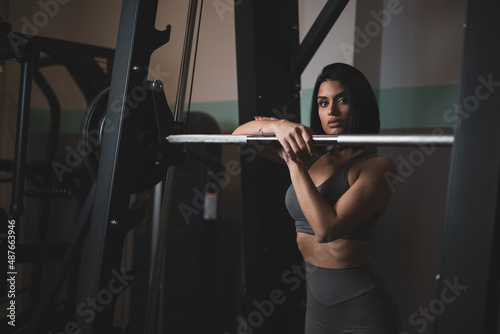 A pretty girl training in a gym.