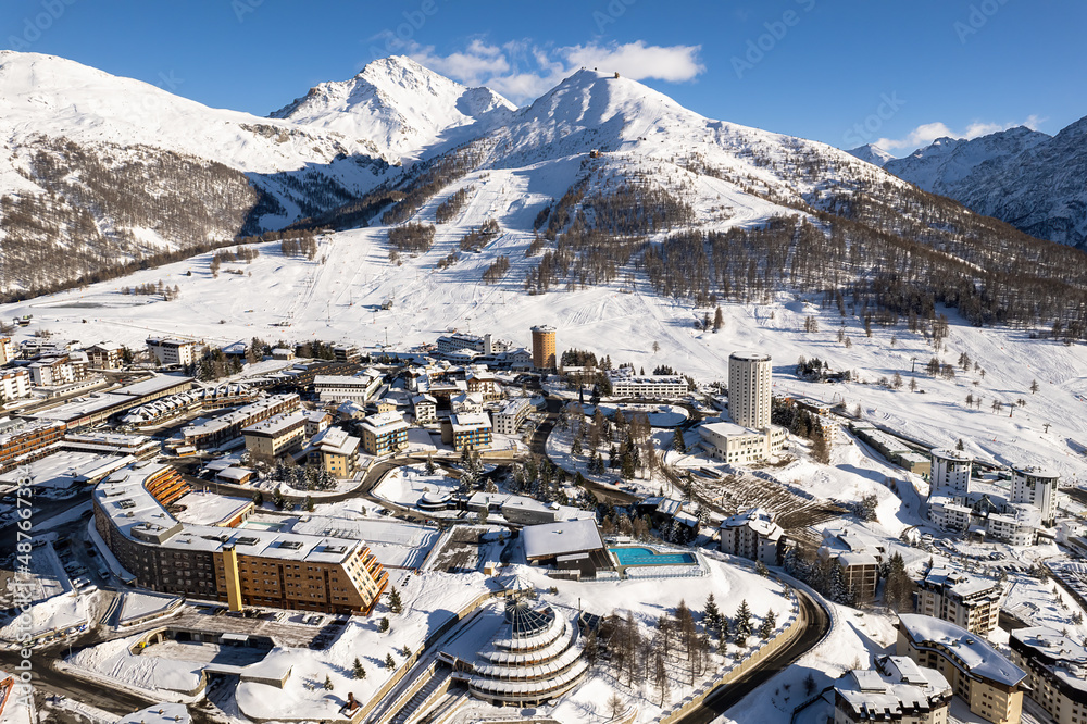 Aerial view of Sestriere village from above, famous ski resort in the italian western Alps, Piedmont, Italy. 