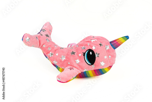 A pink whale plush with a unicorn horn photo