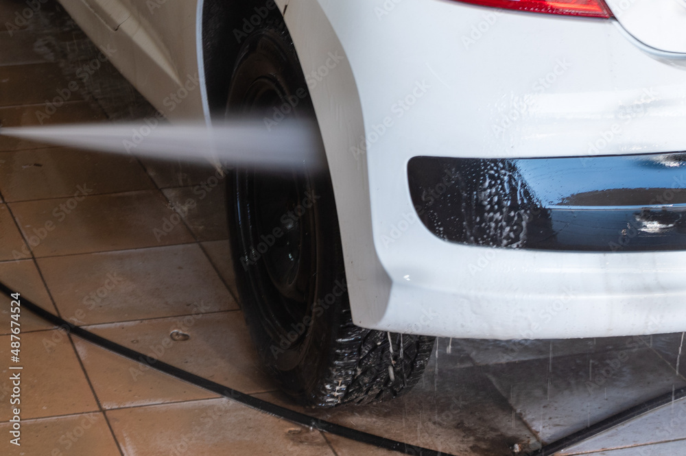 Washing white car with powerful water jet in open garage Stock Photo Adobe Stock