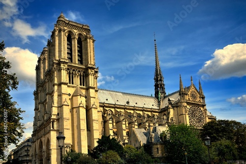 Cathedral of Notre-Dame in Paris feather clouds blue sky side view