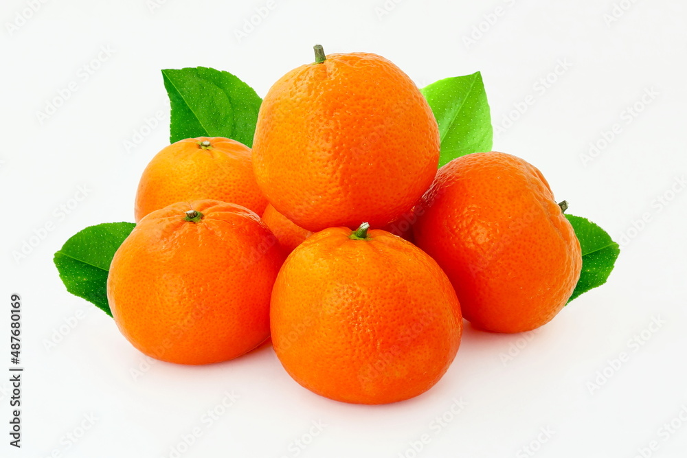 fresh tangerine or mandarin orange fruit with leaves isolated on white background