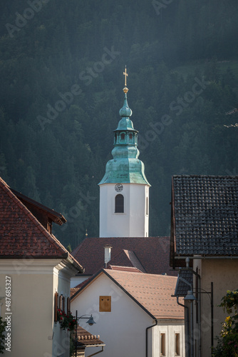 Zupnijska Cerkev Svete Elizabete Ogrske church,a typical austro hungarian slovenian catholic church with its bul steeple clocktower in Ljubno ob savinji, in Slovenia..... photo