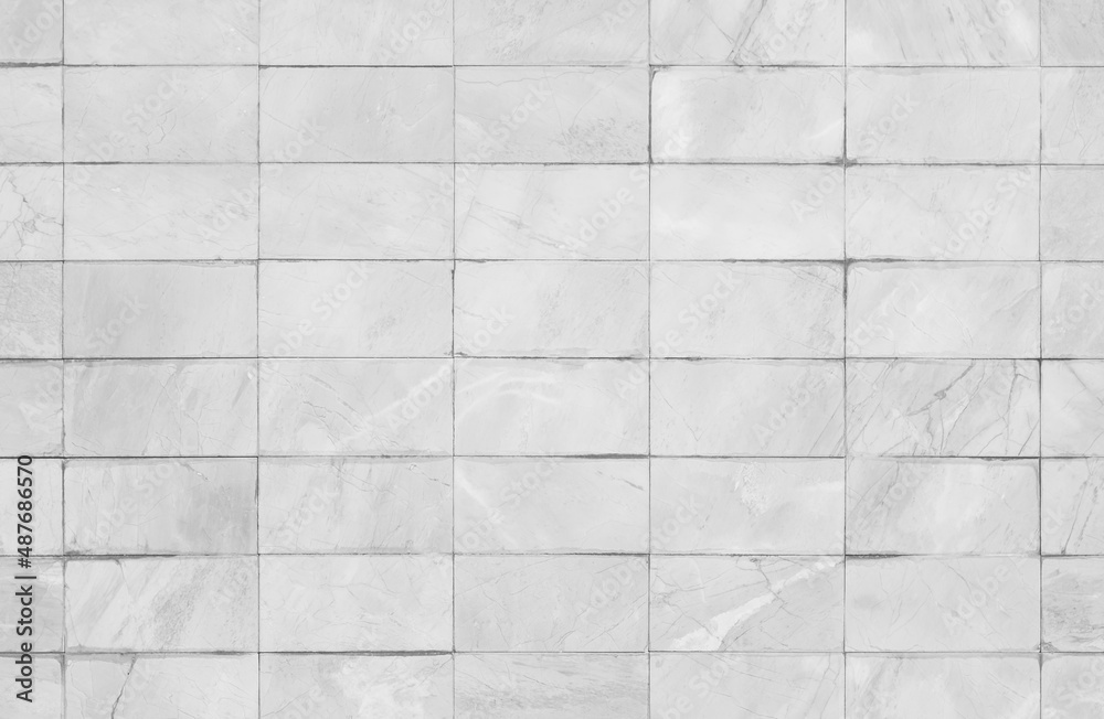 White or gray tiles ceramic wall and floor, marble abstract background. Design geometric mosaic texture decoration. White or gray tiles ceramic wall and floor, marble abstract background. Design geometric mosaic texture decoration.
