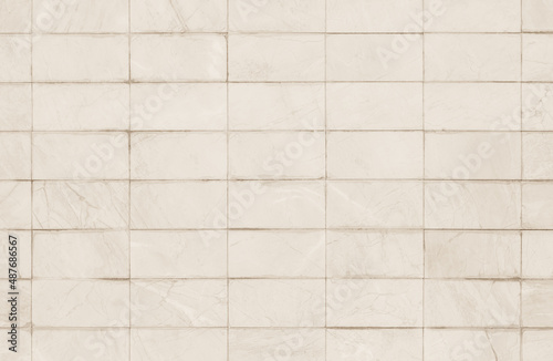 Abstract beige wall marble tiles ceramic background. Design geometric texture decoration.