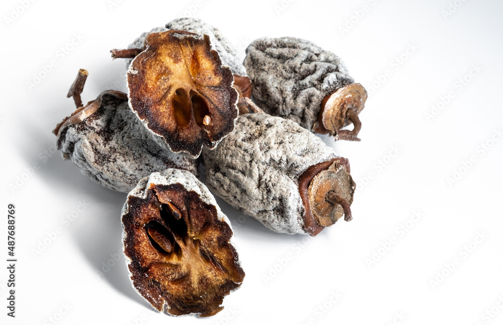 Dried persimmon on a white background. Healthy diet Dried persimmon on a white background. Healthy diet