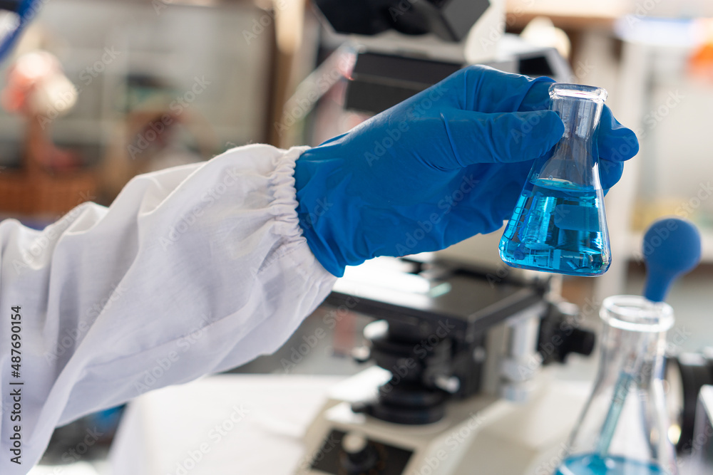 health care researcher holding glass bottle professional working life science lab science technology experiment chemistry lap for hospital scientist working in the lab health care researcher holding glass bottle professional working life science lab science technology experiment chemistry lap for hospital scientist working in the lab