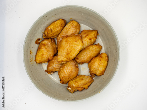 A plate of roast chicken wings