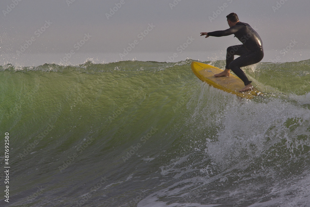 Surfing winter waves at Rincon point in California